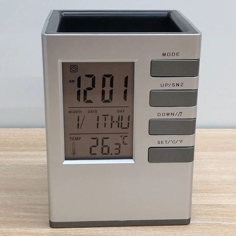 Digital alarm clock with pen stand